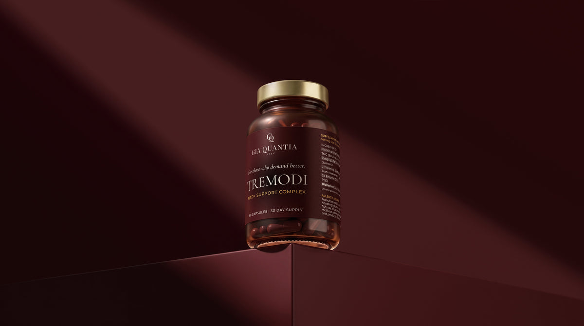 TREMODI bottle on ledge, oxblood background